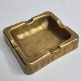Empty pocket brutalist-inspired ashtray in gilded bronze