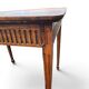 Antique game table in patinated wood in the Louis XVI style.