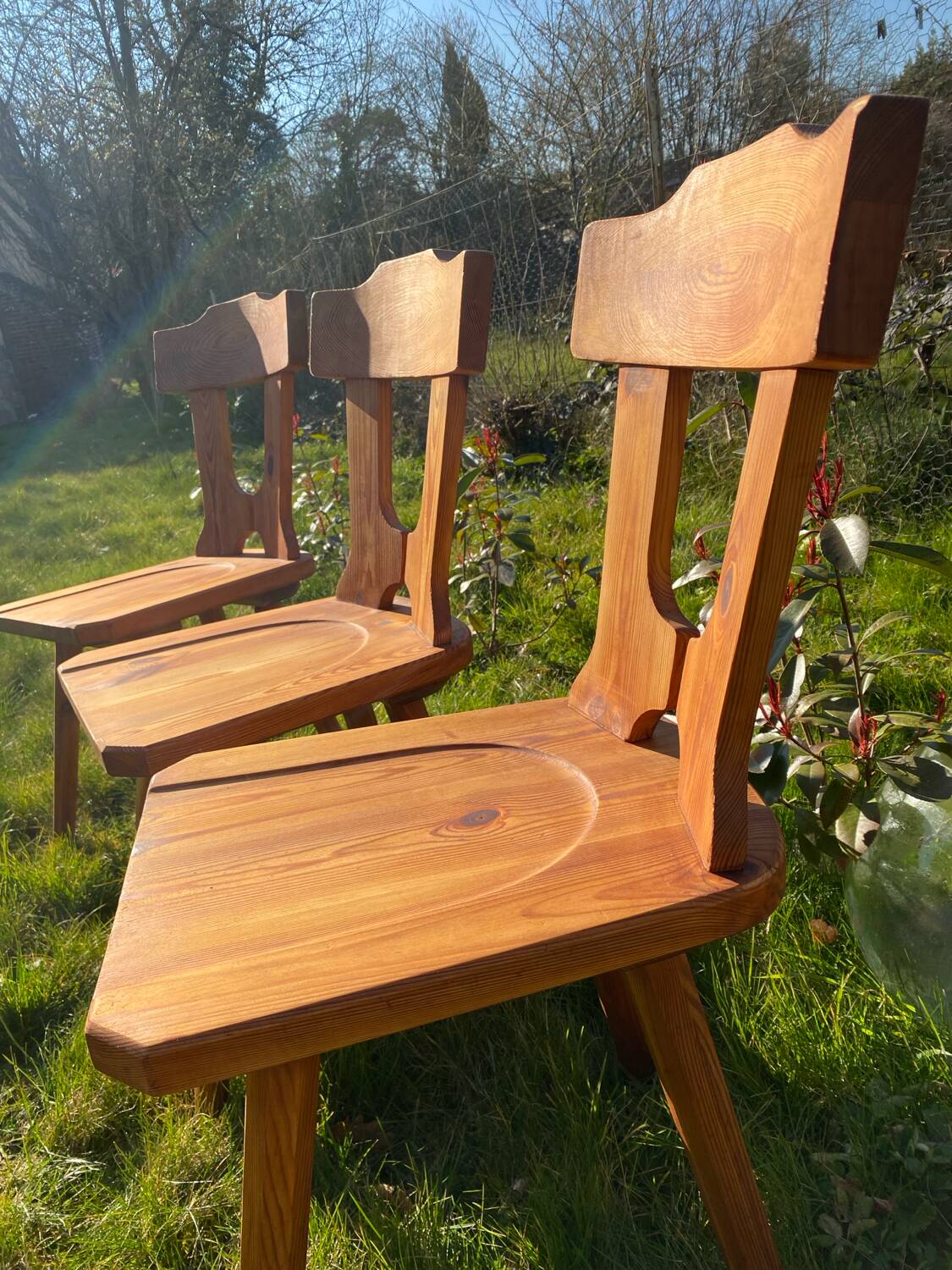 Three solid wood chairs