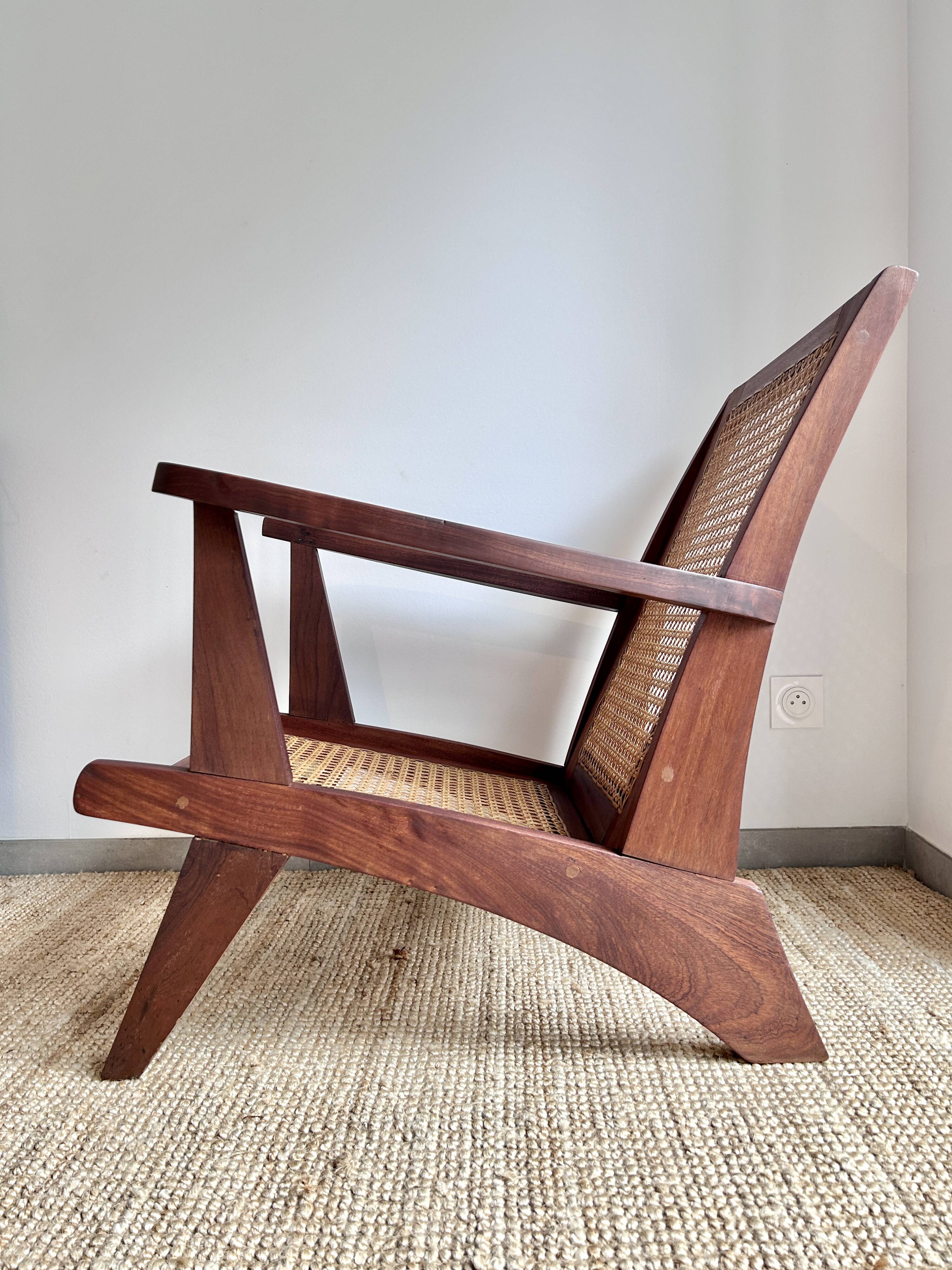 Reconstruction armchair in teak and caning