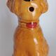 Ancient ceramic pitcher in the shape of a poodle.