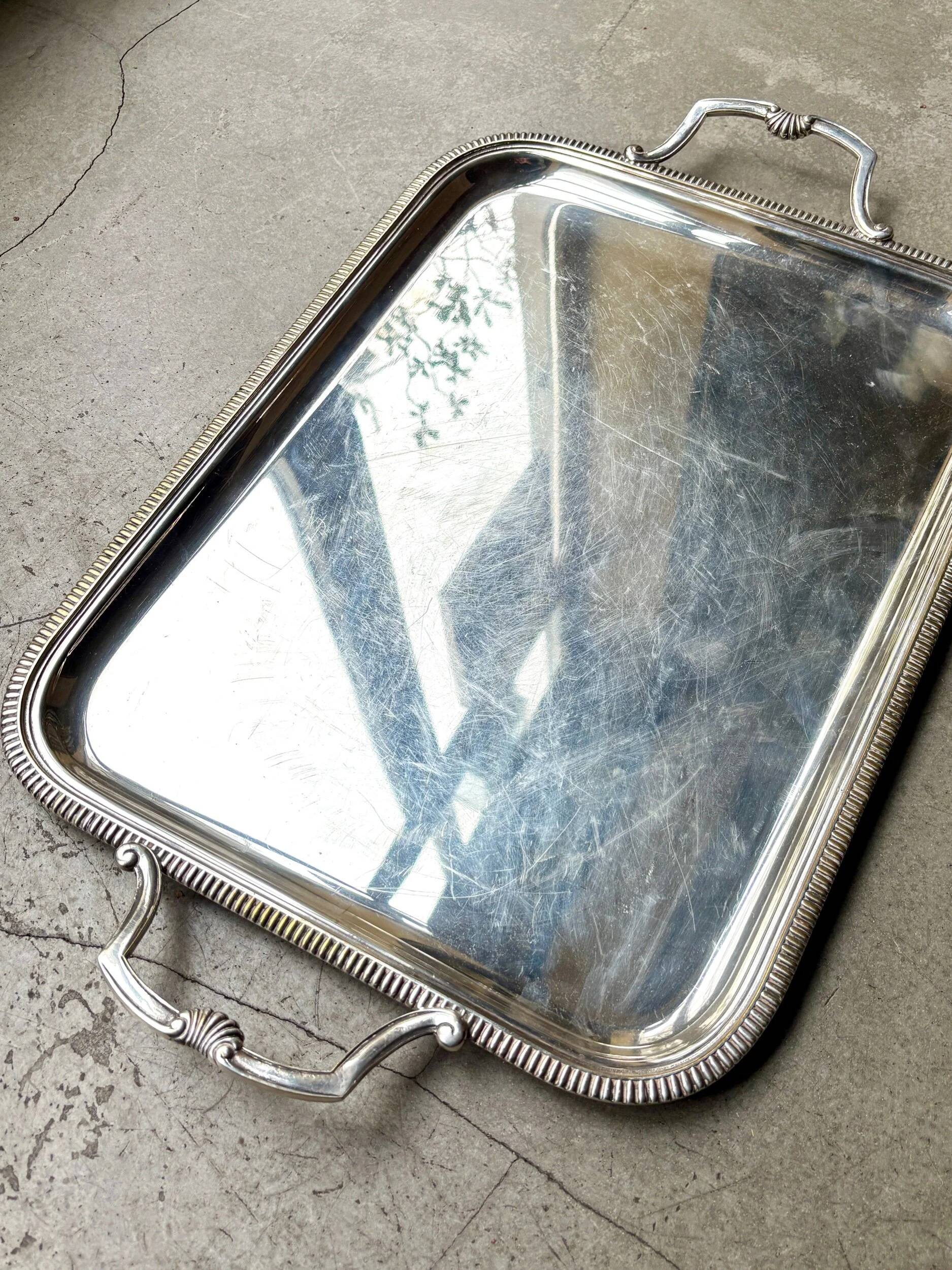 Rectangular silver-plated metal tray with a striated and shell design