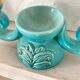 Pair of turquoise and gold double candlesticks
