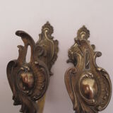 Pair of embraces in brass or bronze