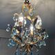 Antique Italian chandelier with cage and blue tassels