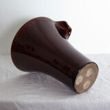 Brown and green vase with open edge rolled up
