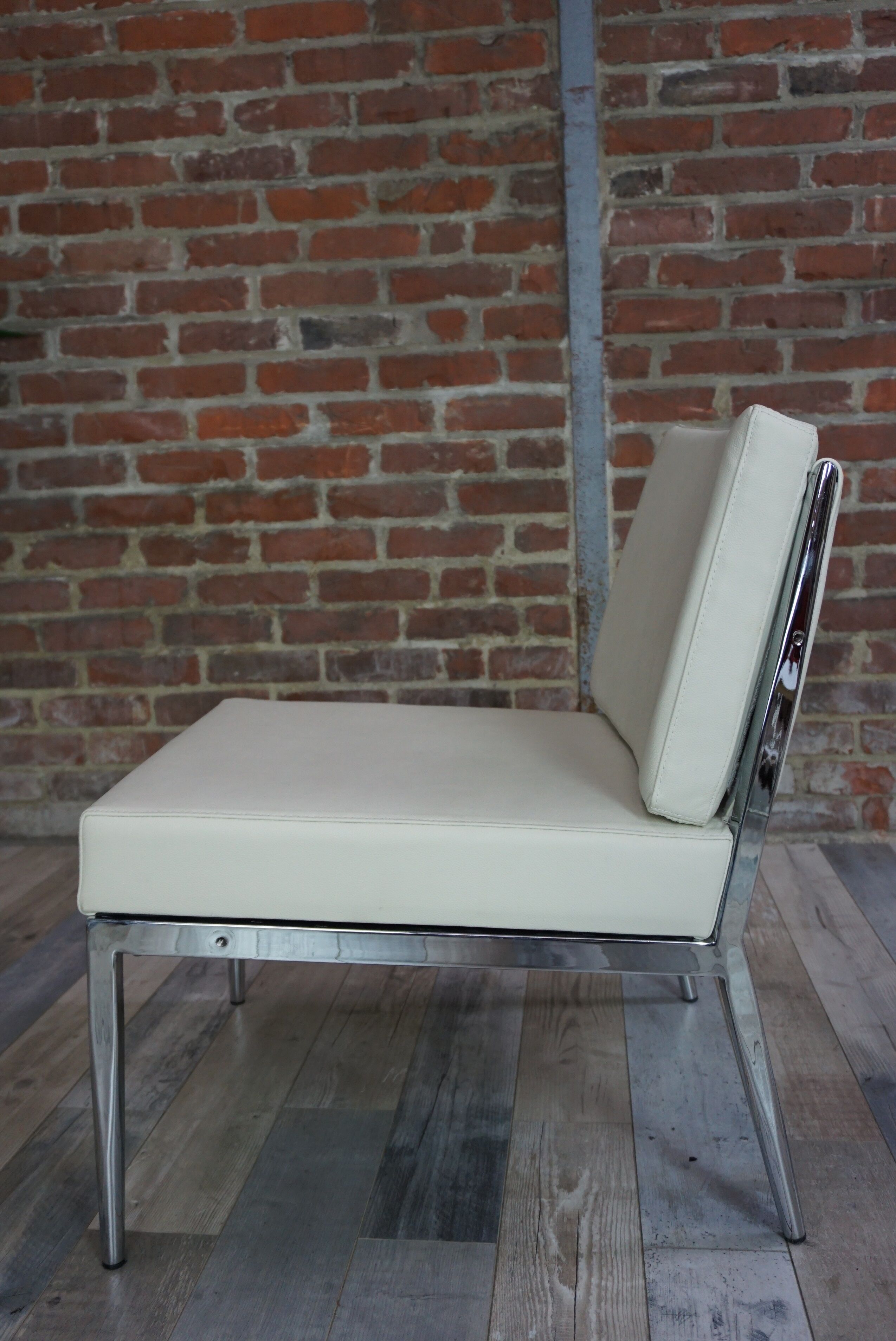 Pair of chrome and leather armchairs