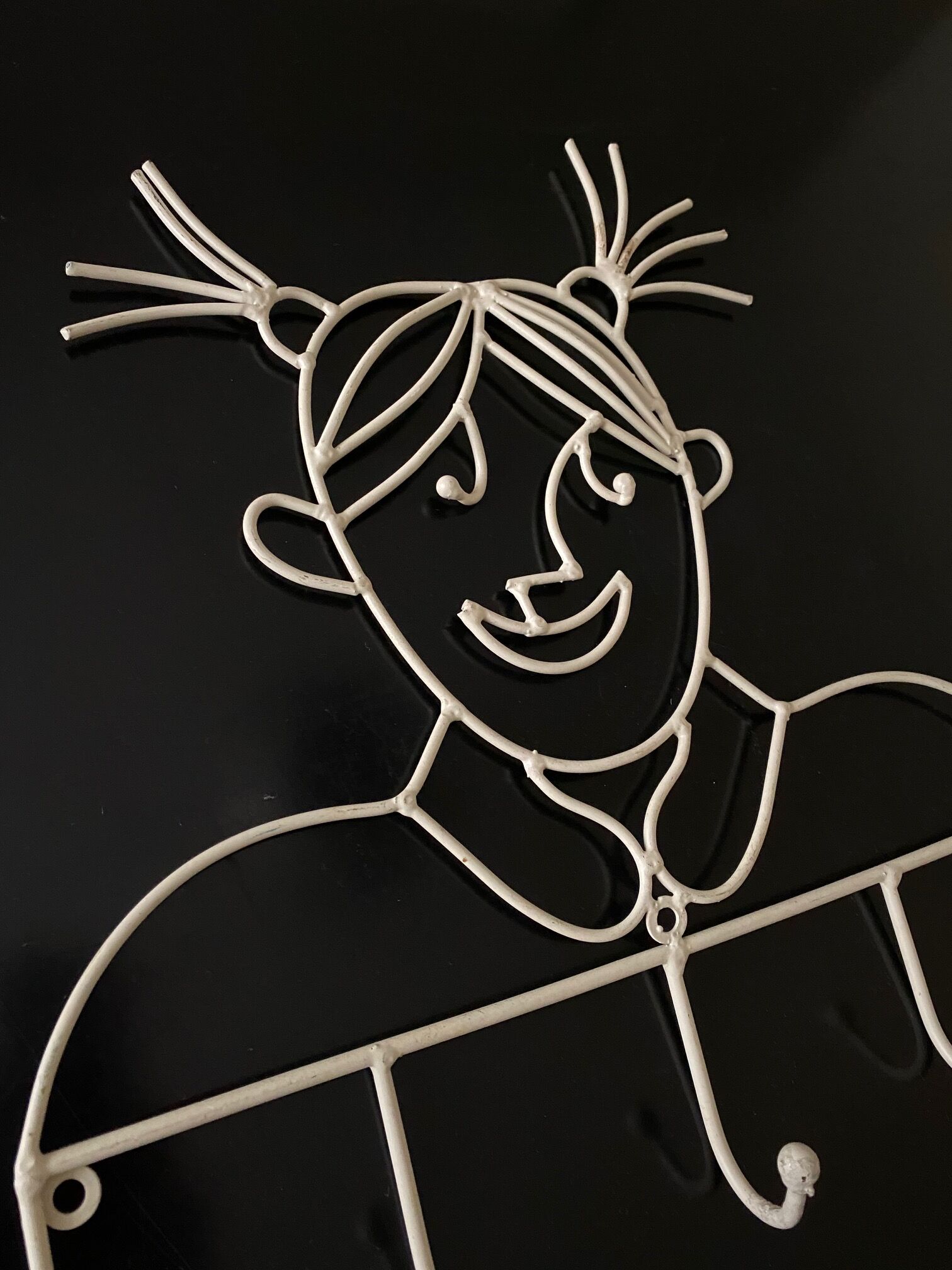 Pair of iron coat holders girl and boy