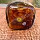 A brown speckled vase with yellow spots pattern is called "scale of".
