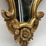 Wooden mirror with gilded stucco