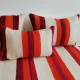 Set of covers for cream and red Moroccan floor sofa.