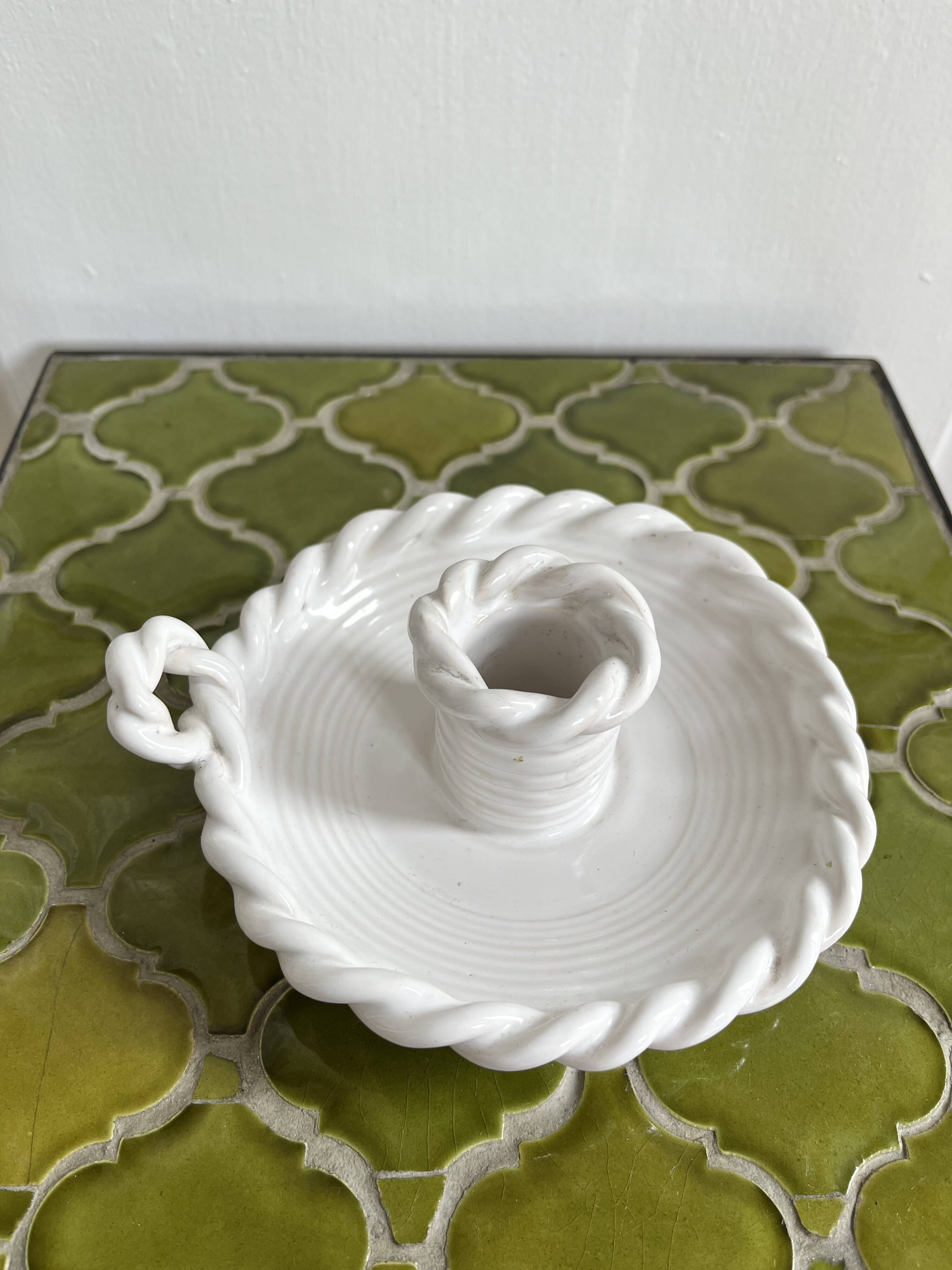 Hand-held candle holder with braided ceramic bowl