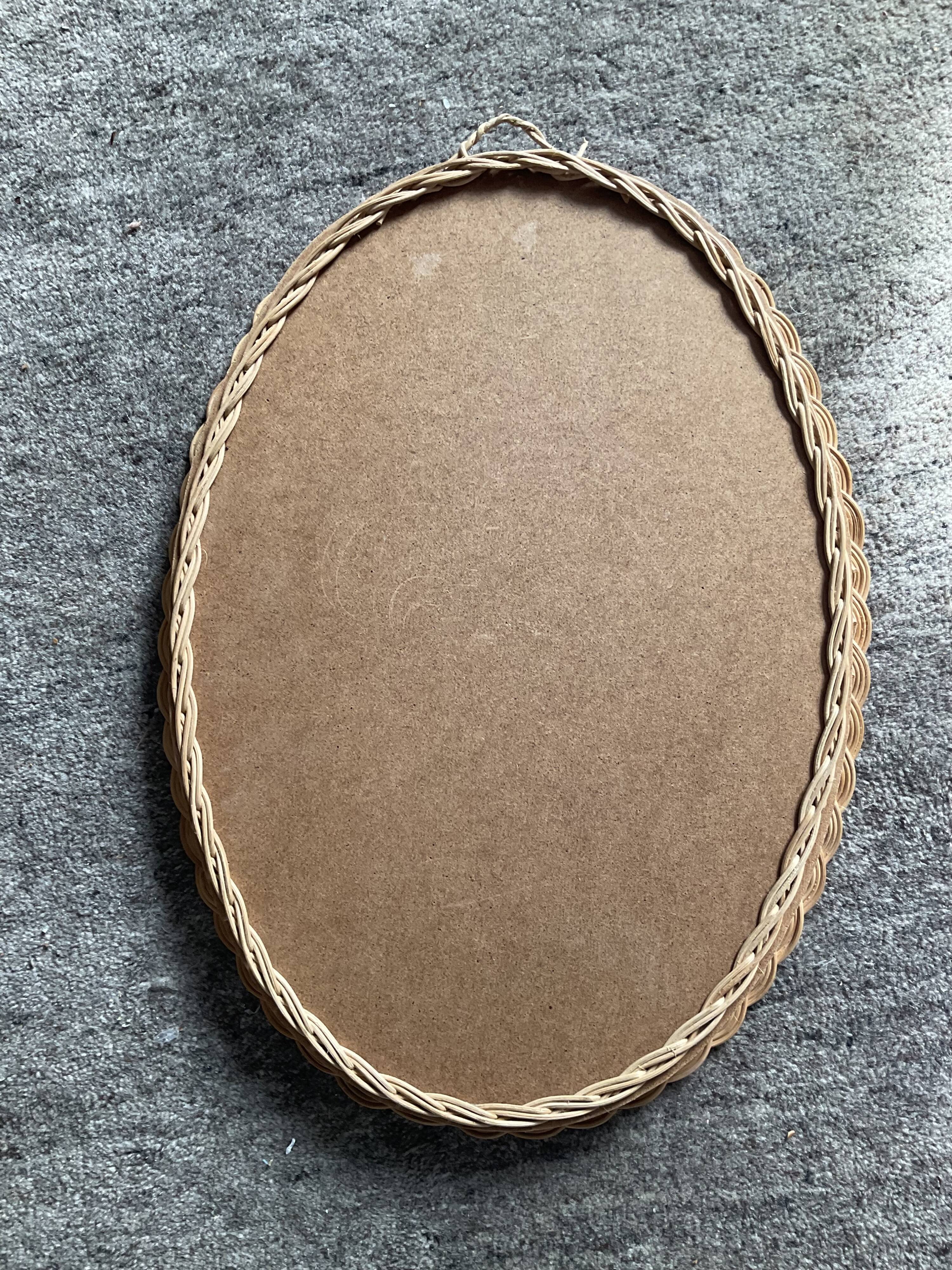 Vintage oval rattan mirror
