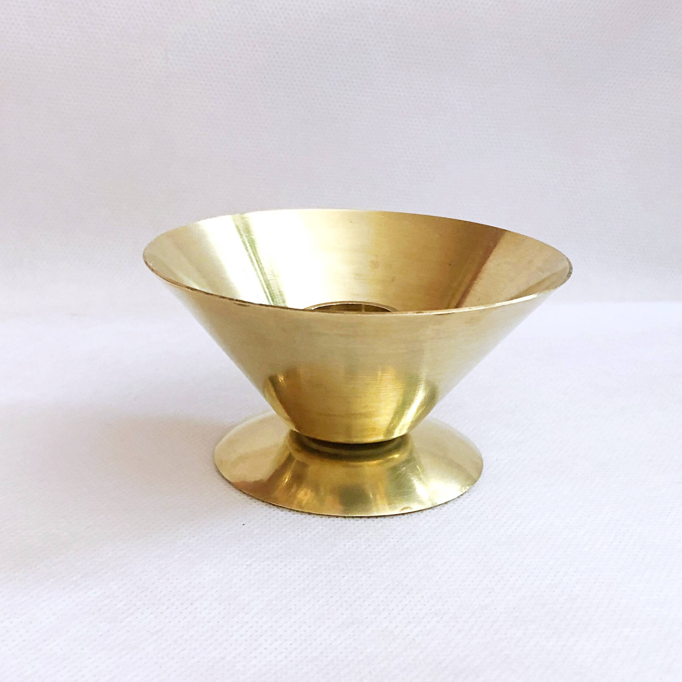 Table candle holder in golden brass