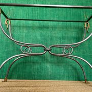 Polished steel and brass console, probably Maison Jansen, France, mid-century modern Hollywood Regency.