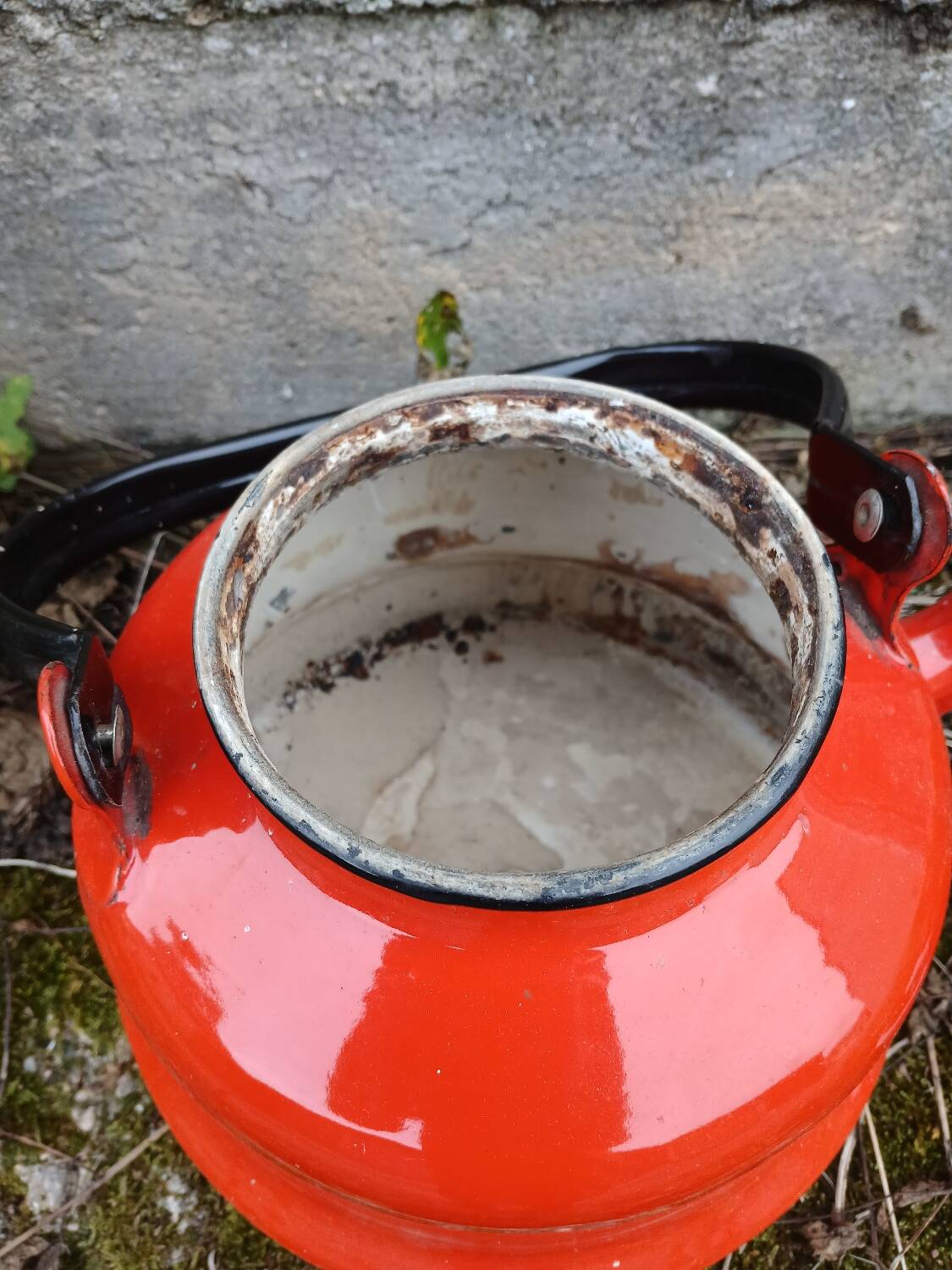 Antique teapot in red enamelled sheet metal