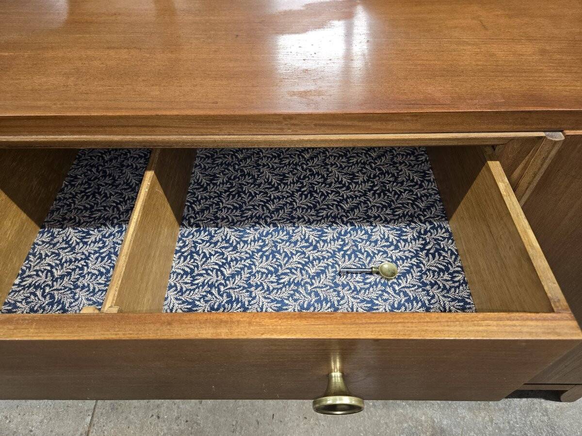 According to André Arbus, a sideboard in a row from the Art Deco period in blonde mahogany.