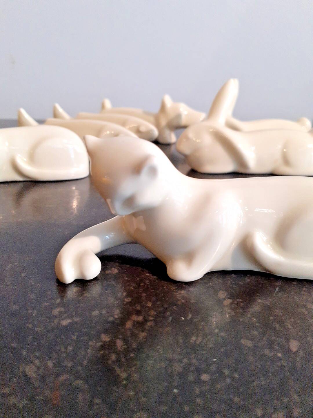 Set of 7 porcelain knife rests, animals, dog, cats, fish, rabbit.