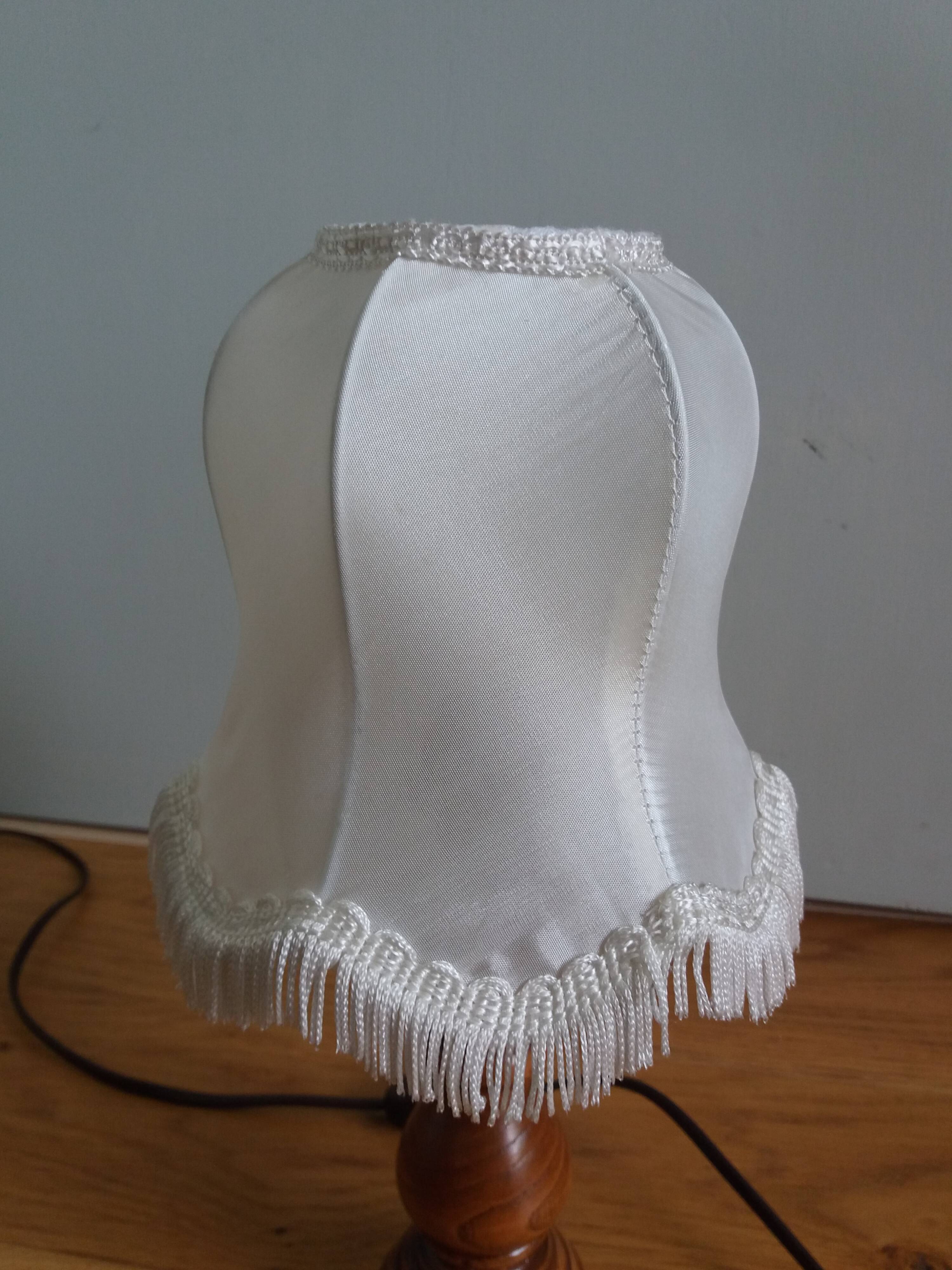 Turned wood lamp with fabric lampshade