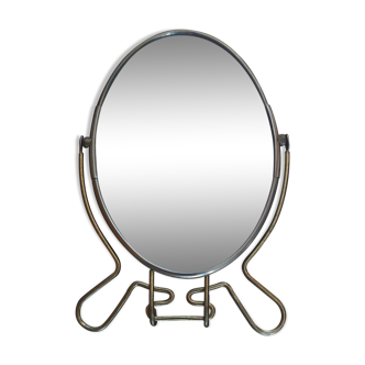 Vintage oval mirror on suspended stand