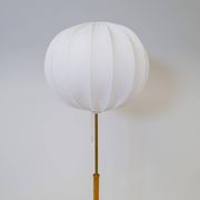 Mid-century floor lamp in brass and oak by Falkenbergs Belysning, Sweden, 1960s.