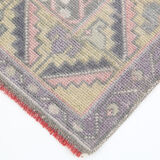 Tapis turc en laine rose poussiéreux