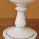 Footed glass in the shape of a chalice in white opaline with a floral decoration.