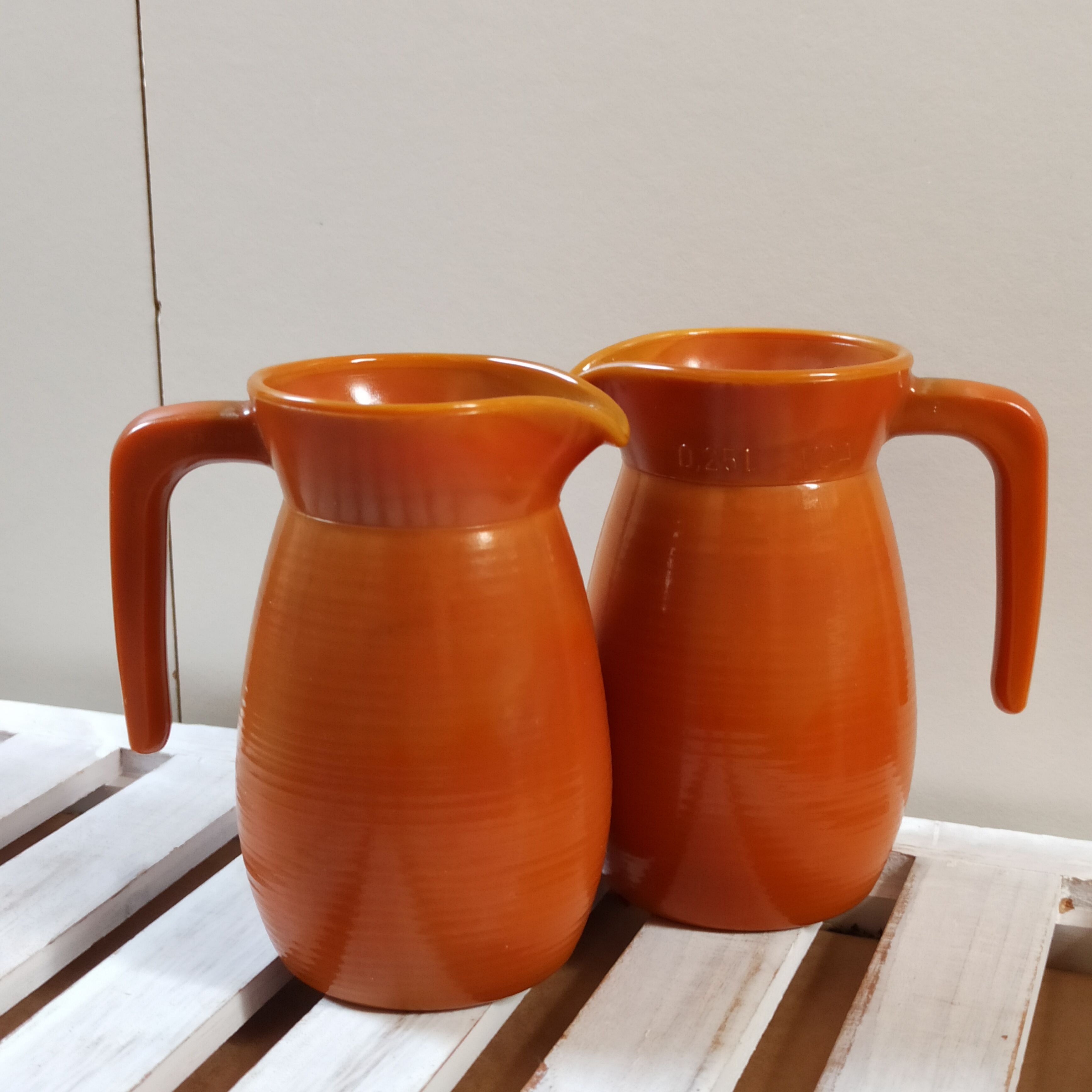 Two vintage arcopal volcano pitchers