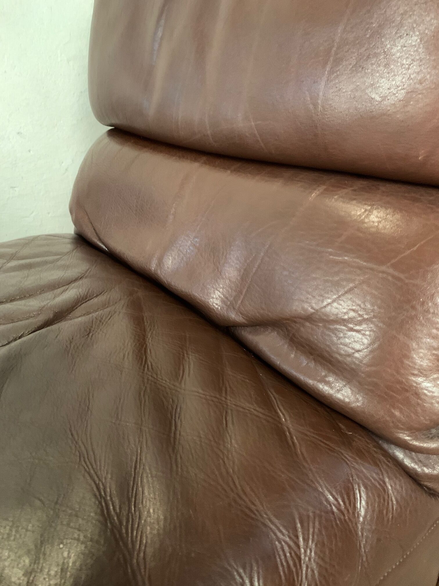 A pair of leather armchairs, Switzerland, 1970s