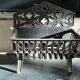 Fireplace grate with clover pattern