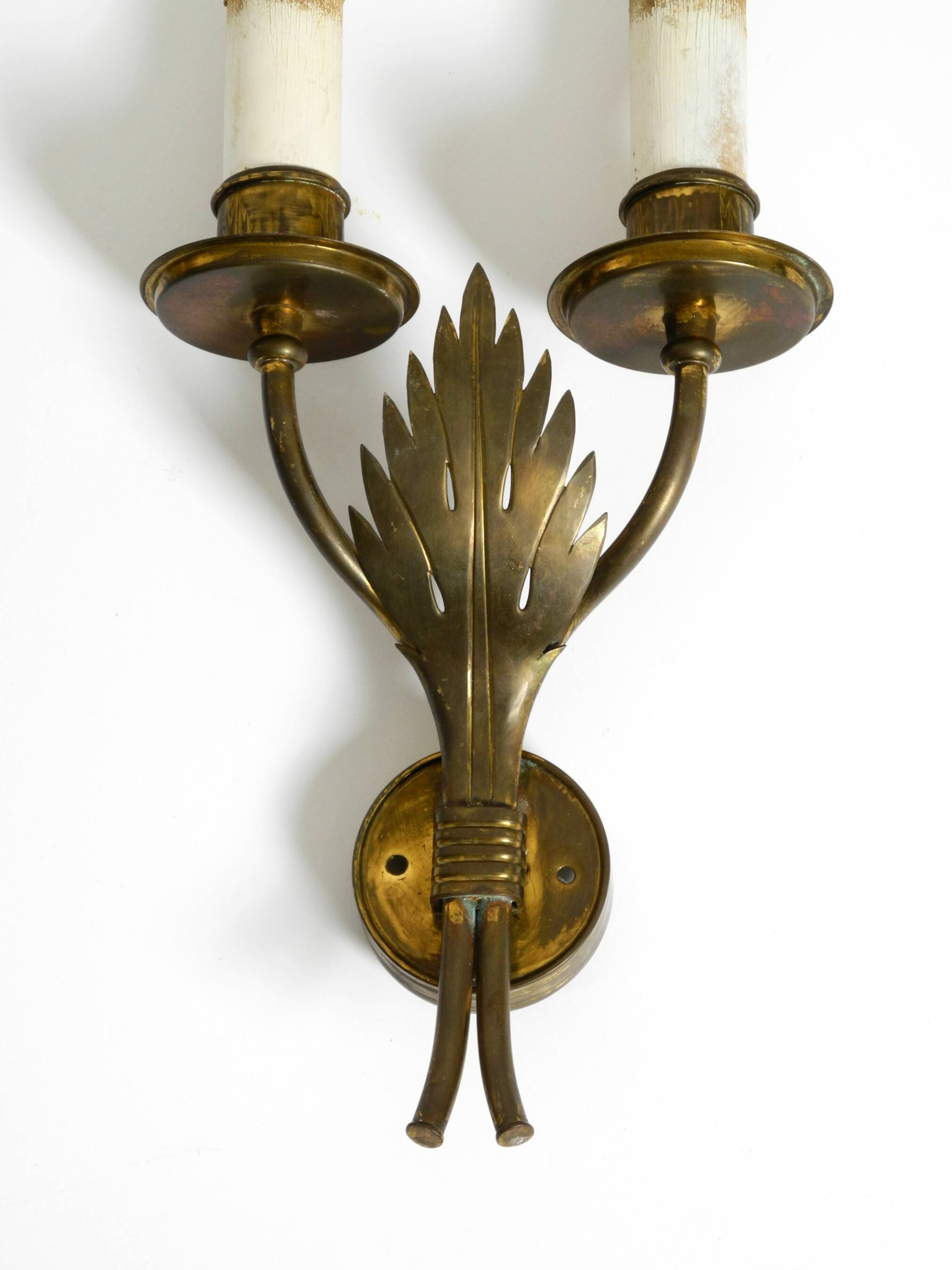 A pair of mid-century modern brass wall lamps by Vereinigte Werkstätten