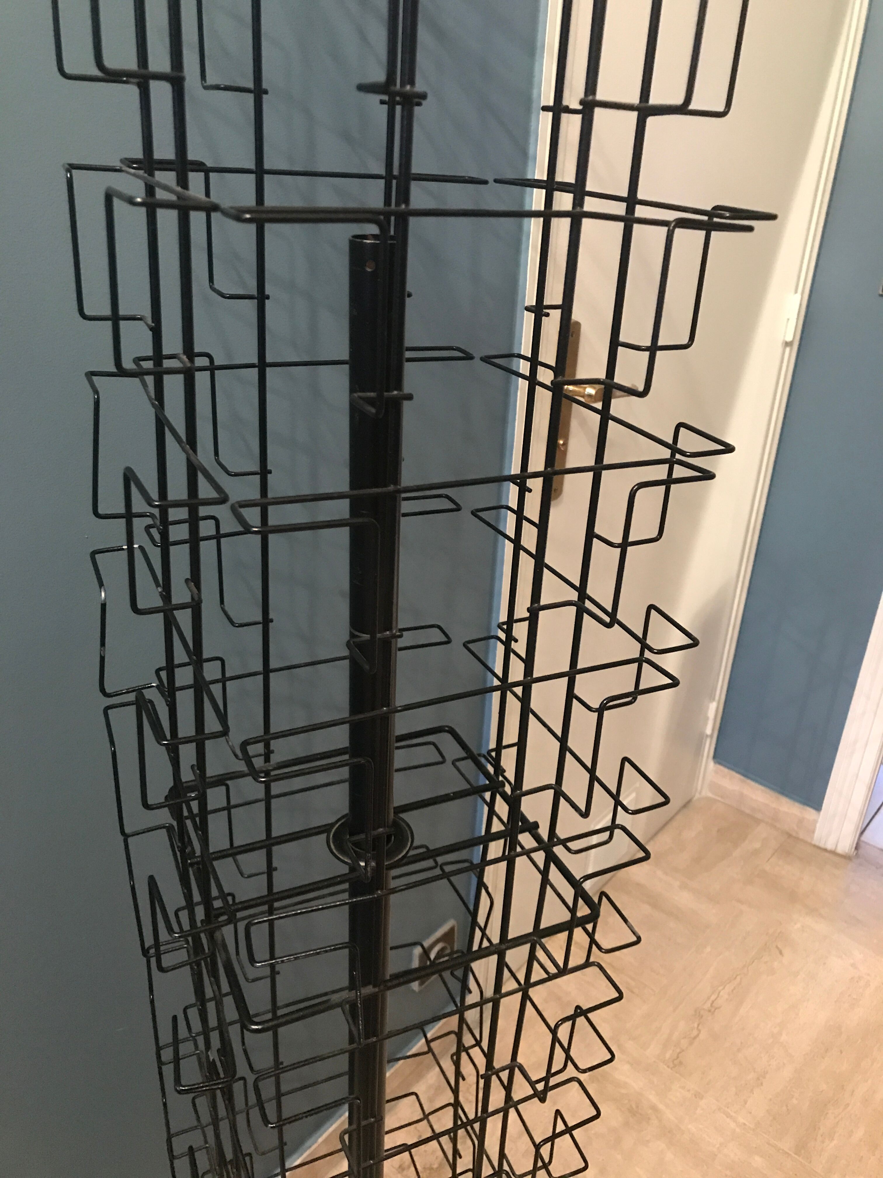 Display postcards and photos in black metal turnstile