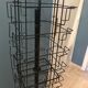 Display postcards and photos in black metal turnstile