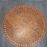 Handcrafted round coffee table of Essaouira type made of thuya wood, with inlays.