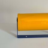 Adjustable wall lamp in yellow and blue.