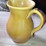 Set of three glazed stoneware pitchers