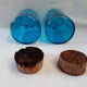 pair of apothecary vials in blue glass jar