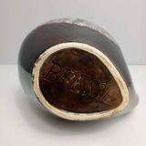 Brown ceramic pitcher with coloured patterns signed Bresse.