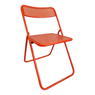 Perforated metal folding chair