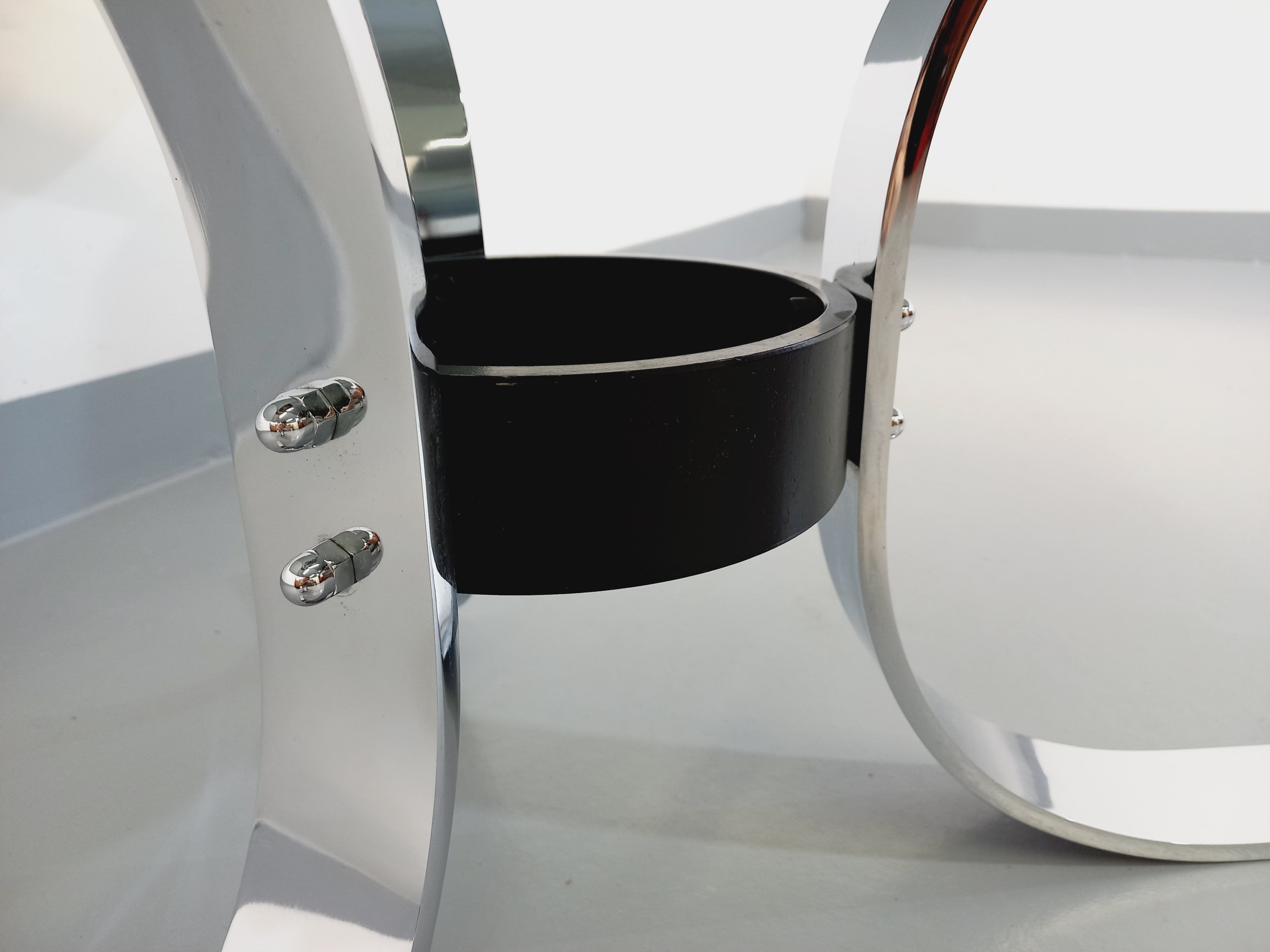 Vintage round coffee table in glass, chromed metal and black metal Space Age style of the 70s