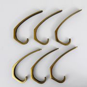 Up to 2 mid-century brass wall hooks by Hertha Baller, Austria, 1950s.