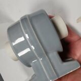 Bathroom lamp with light gray ceramic base,  and milky white opal glass.