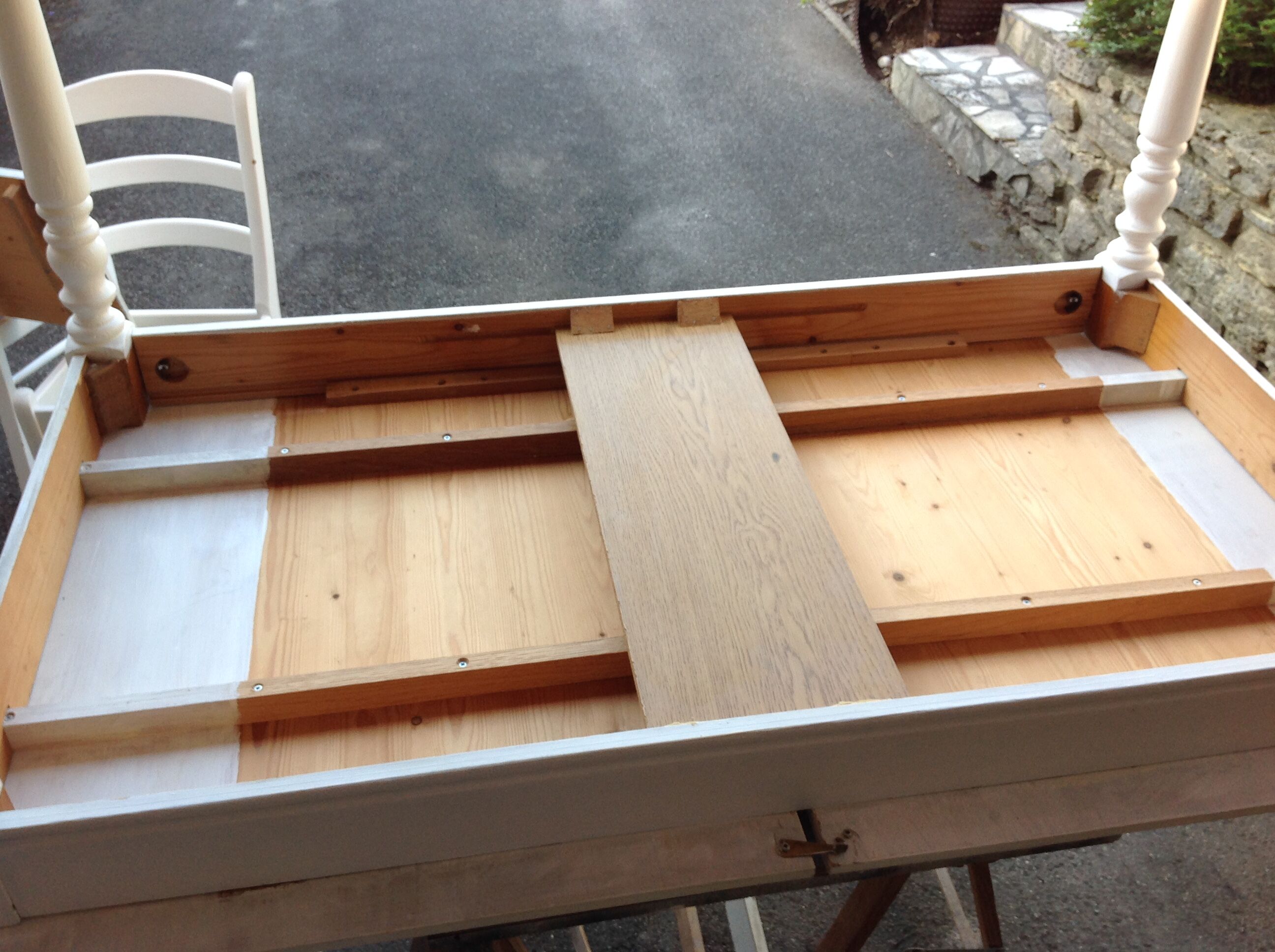 White farmhouse table set and four chairs