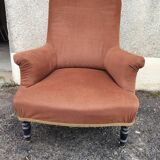 Antique brown velvet tub chair – turned legs and brass rings.