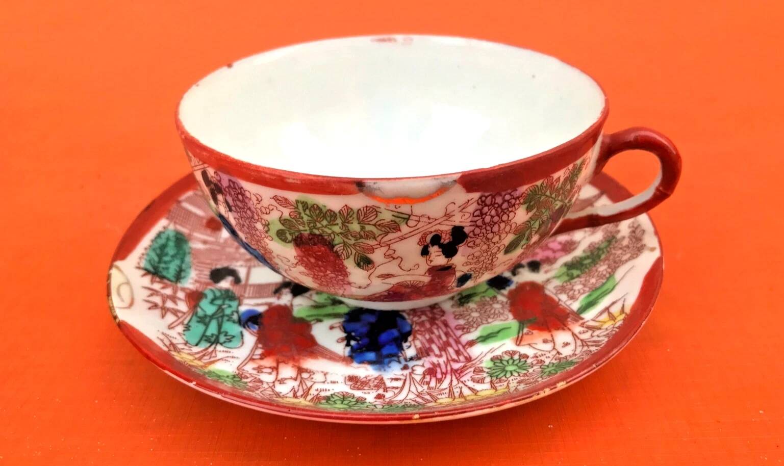 Antique tea cup and saucer with Japonisme decoration.