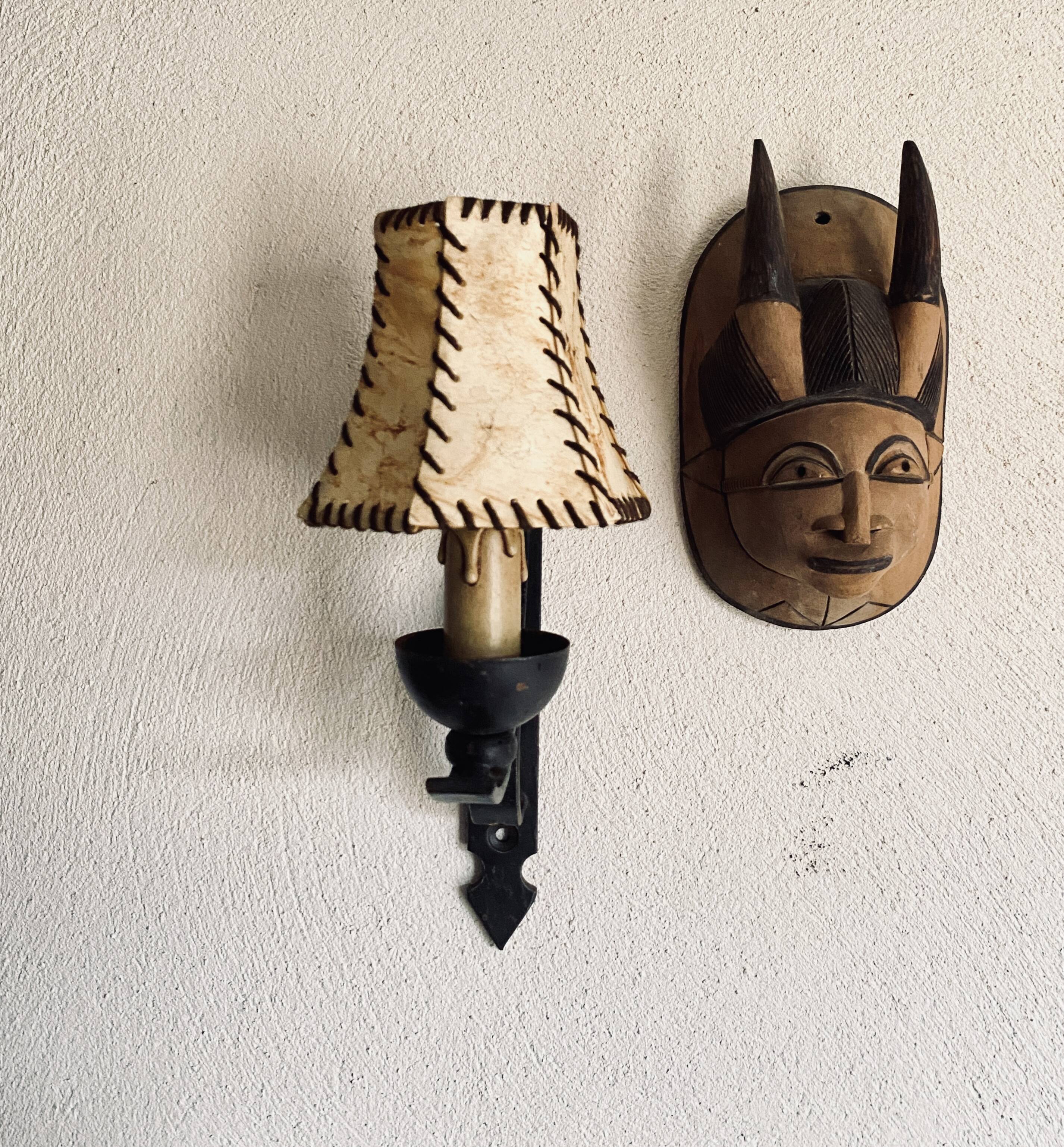 Wrought iron wall light, fabric cable