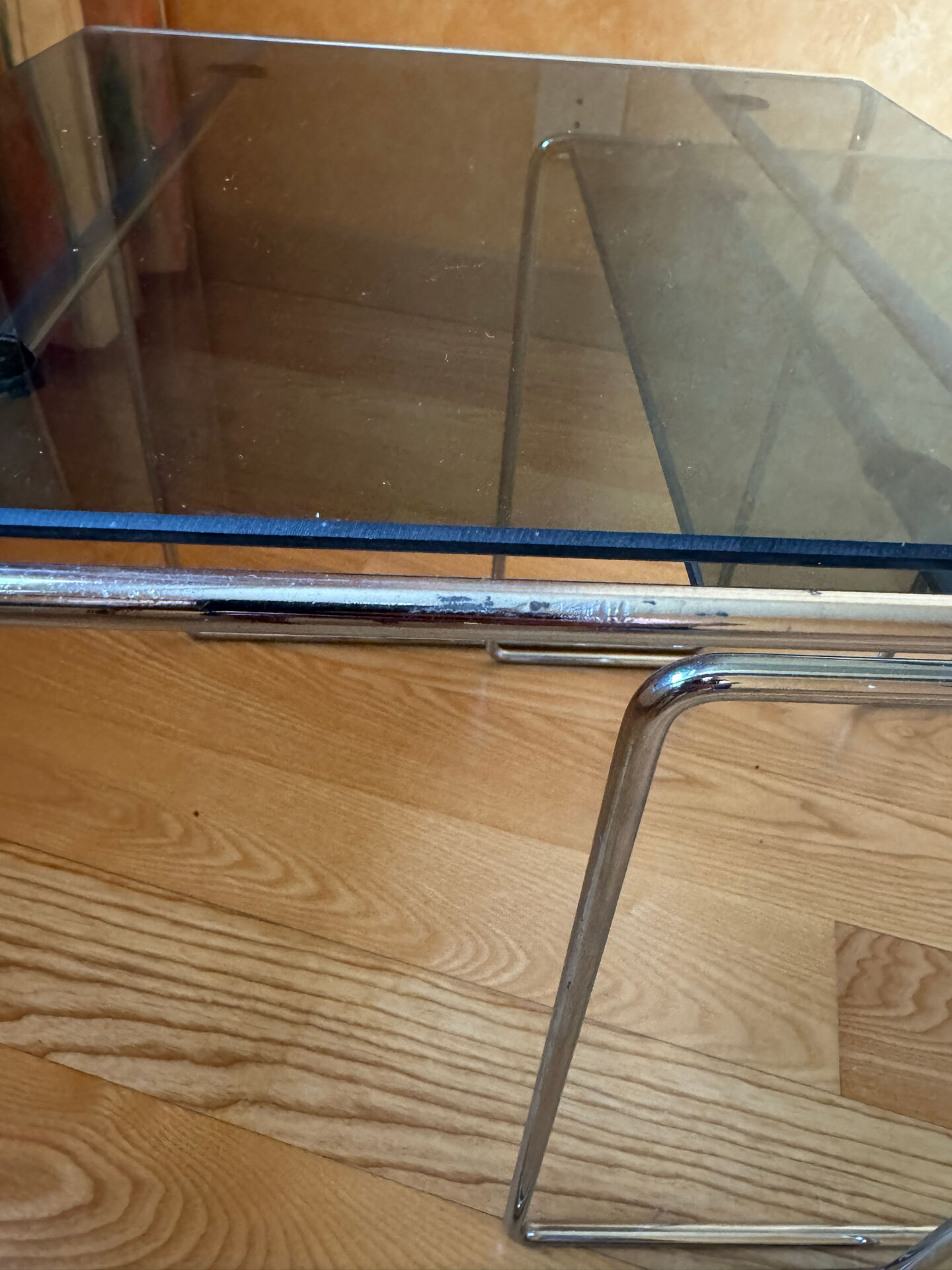 Nest of coffee tables in glass and metal.