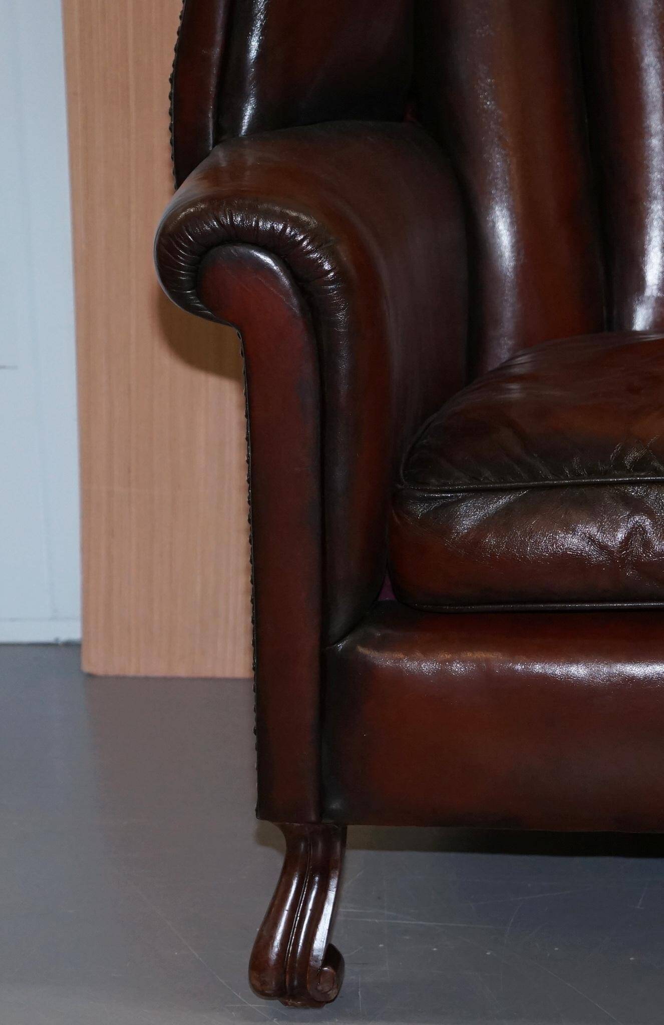 Victorian leather canapé and armchair, barrel back, circa 1860, restored.