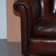 Victorian leather canapé and armchair, barrel back, circa 1860, restored.