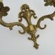 Pair of two-armed fire pot wall lights in gilded bronze.